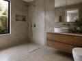 Modern bathroom with seamless Cemento 3D microcement over tiled floor and shower walls