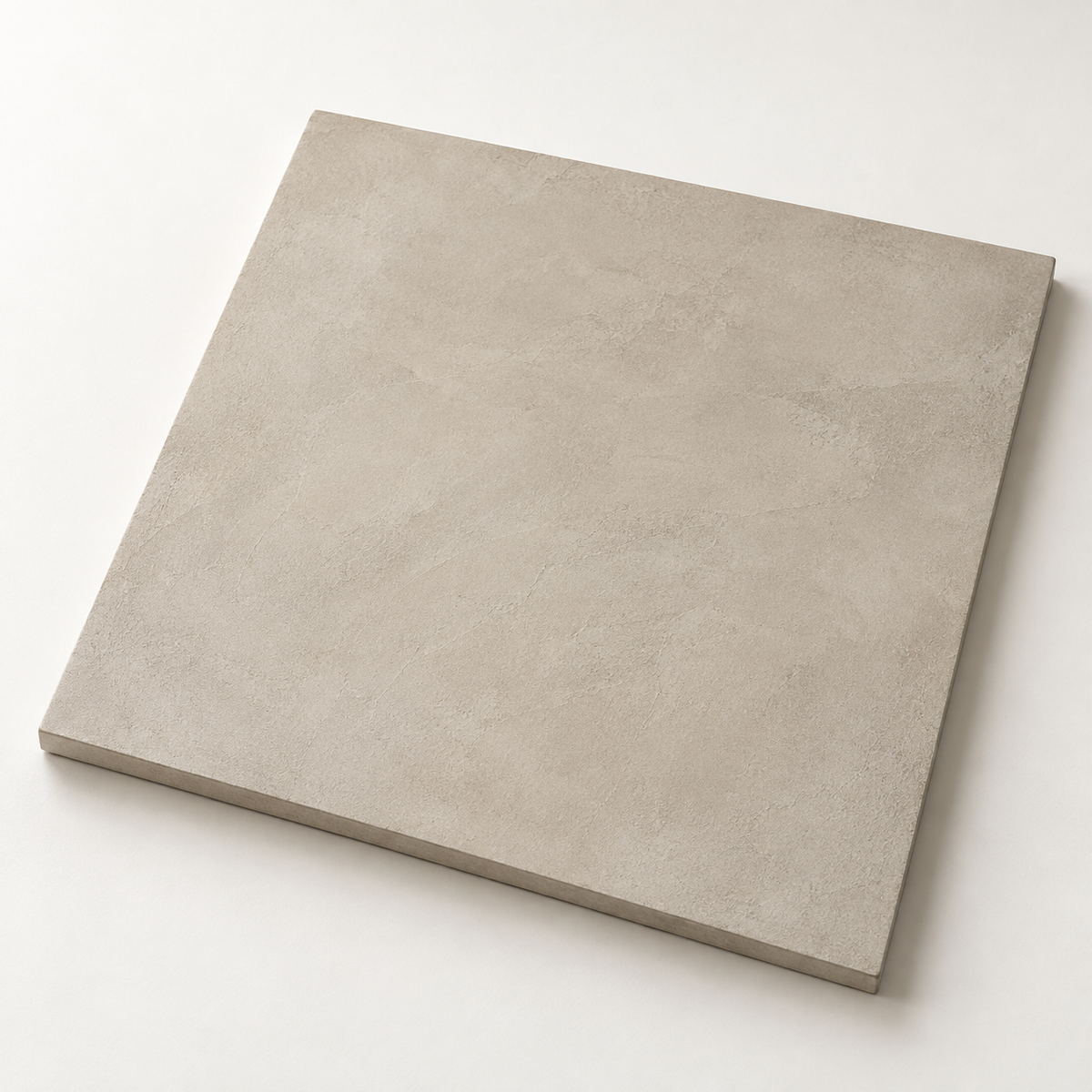 Illustrative microcement sample board showing a warm neutral hand-trowelled finish